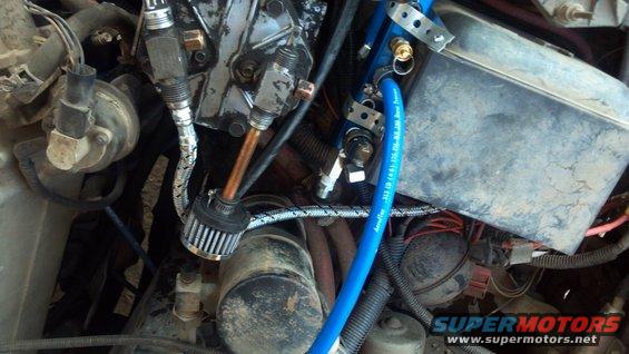 Looking down on top of the setup. The steel braided line is the outlet from the compressor, and will screw into the check valve of the manifold once I get an elbow to make that bend a little easier.