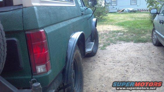 I thought i'd improve matters a bit.  Been fighting rust since day one around the wheel wells, so I opted to cut it out, cutting at the first body line, then bending the metal back at the 2nd line.  Lawn edging from the garden store provided my flares.