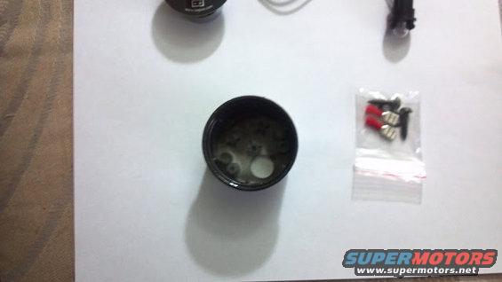 I disassembled the voltmeter and painted the case black