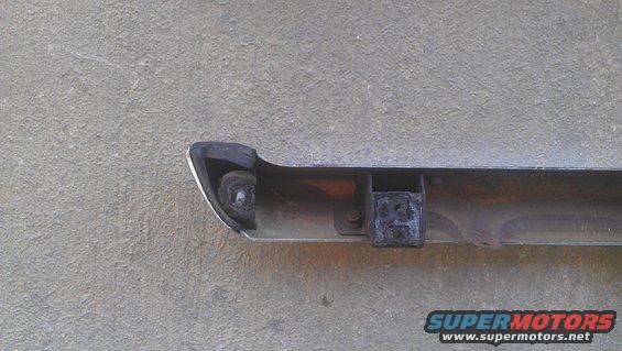 Chrome bumper section with black rubber end cap and mounting bracket