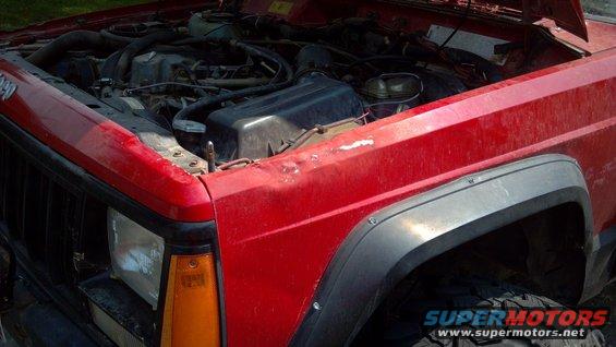 1995 Jeep Cherokee front fender and engine bay with hood up