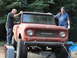 1966 International Scout 800 - The front grille of an old International pickup truck has the brand name visible.