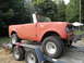 1966 International Scout 800 - Red 1966 International Scout 800 being transported on a trailer.