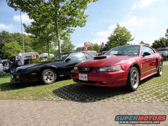 Red Ford Mustang with hood scoop and license plate T23 LBP