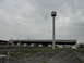 2003 Mercury Marauder - A deserted toll plaza with a distinctive tower stands under an overcast sky.