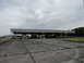 2003 Mercury Marauder - An abandoned inspection station with numbered booths sits under a cloudy sky.