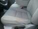 2004 Ford F-350 - The driver's seat shows significant wear and tear, with a large rip on the side bolster.