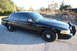 2004 Ford Crown Victoria - Black 2004 Ford Crown Victoria sedan parked on asphalt with a push bar on the front.