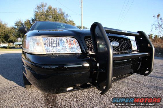 Black 2004 Ford Crown Victoria with a push bar, front view