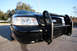2004 Ford Crown Victoria - This black 2004 Ford Crown Victoria is equipped with a heavy-duty push bar on the front grille.