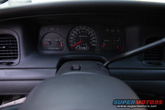 2004 Ford Crown Victoria dashboard with speedometer, tachometer, fuel gauge, and odometer showing 081275
