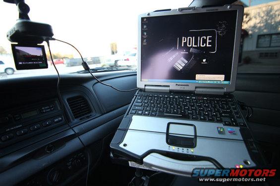 2004 Ford Crown Victoria interior with Panasonic laptop and dashcam