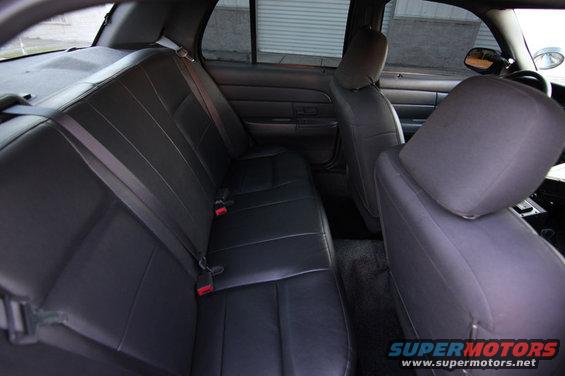 2004 Ford Crown Victoria interior showing rear seats and door panel
