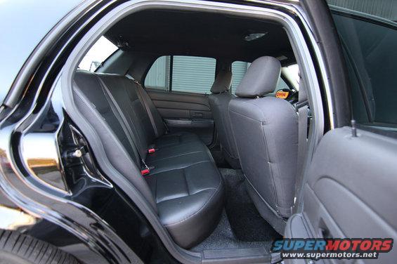 Back seat and interior of a black Ford Crown Victoria