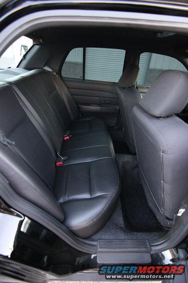 Black leather rear seats and door panel inside a car