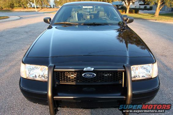 Front view of a black 2004 Ford Crown Victoria Police Interceptor with a push bar