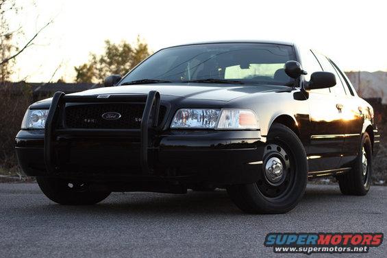 Black 2004 Ford Crown Victoria with push bar, front 3/4 view