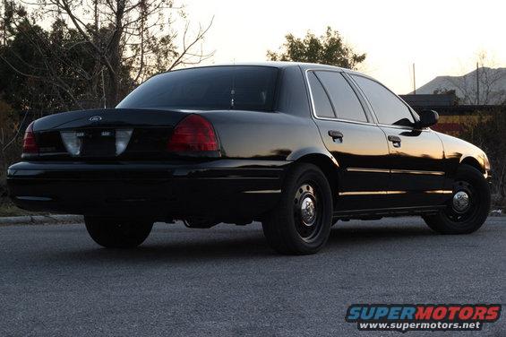 Black 2004 Ford Crown Victoria rear three-quarter view