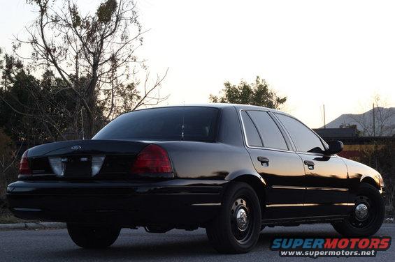 Black 2004 Ford Crown Victoria sedan, rear 3/4 view