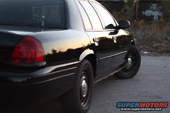 Black 2004 Ford Crown Victoria, rear quarter panel and side view