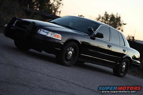 Black 2004 Ford Crown Victoria with push bar