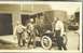 1909 Ford Model T - Three men pose with a 1909 Ford Model T in front of a barn.