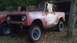 1961 International Scout 80 - A weathered 1961 International Scout 80 sits outdoors, showing its iconic body style and modifications.