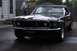 1969 Ford Mustang - This black 1969 Ford Mustang convertible is shown from a front 3/4 angle in a driveway.