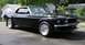 1969 Ford Mustang - This black 1969 Ford Mustang convertible is shown from a 3/4 front angle.