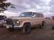 1988 Ford Bronco - This Jeep Wagoneer, likely from the early 1980s, is seen in a three-quarter front view with aftermarket wheels and a roof rack.