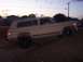 1988 Ford Bronco - This Jeep Cherokee Chief is angled on a dirt mound as the sun sets.