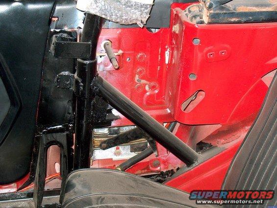 Triagulated the normally bolted in 2-point rollbar to a welded in 4-point. Tied in the rear of the bar to the vert rienforcement panels. That coincides with the area underneath where the Global West subframe connectors attach.