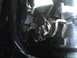 2003 Ford Crown Victoria - A detailed view of a vehicle's throttle linkage mechanism.