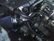 2003 Ford Crown Victoria - Close-up view of an engine bay an aftermarket air intake system and various engine parts.