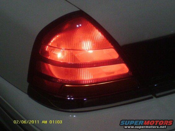 1998 Ford Crown Victoria taillight, red, close-up, rear quarter view