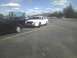 2003 Ford Crown Victoria - White 2003 Ford Crown Victoria police car with push bumper parked in a lot.