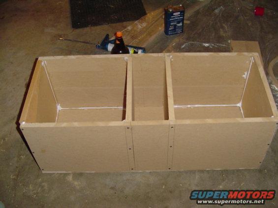 Custom speaker box with three compartments, made of particle board and glue