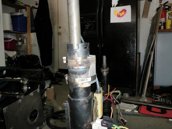 Steering column assembly with visible welds and wiring harness