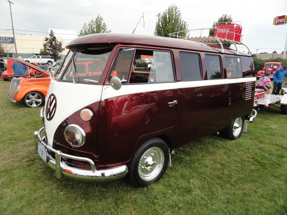 Maroon and white Volkswagen Type 2 Bus with roof rack and Coca-Cola cooler