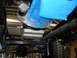 1992 Ford Bronco - Underside view of a vehicle's engine bay, highlighting a blue engine component and starter motor. The Supermotors.net logo is present in th…