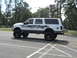 2001 Ford Excursion - This modified Ford Excursion features a lifted suspension and custom skull graphics along its body.