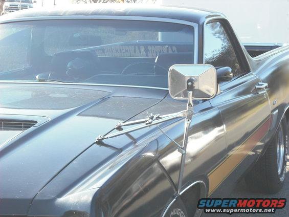 Black 1970 Ford Ranchero with side stripe and fender mirror