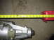 1971 Ford Ranchero - Measuring tape shows the length of a transmission component on a carpeted floor.