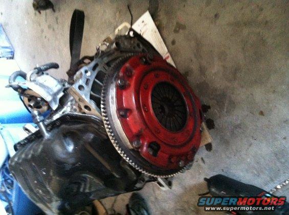 Engine assembly with red clutch and flywheel