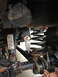 1996 Ford F-150 - Undercarriage view of a vehicle's suspension system with visible rust and wear.