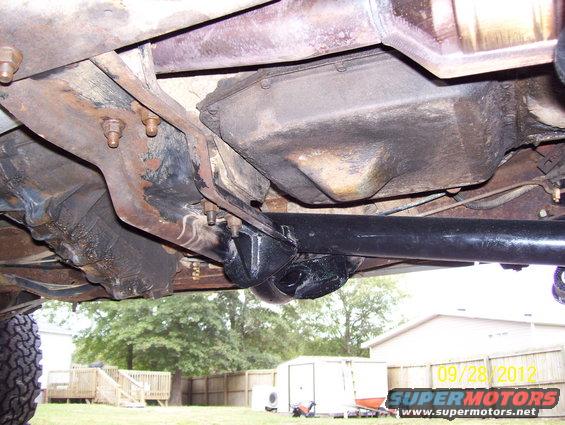 Undercarriage view of a vehicle's drivetrain components and suspension