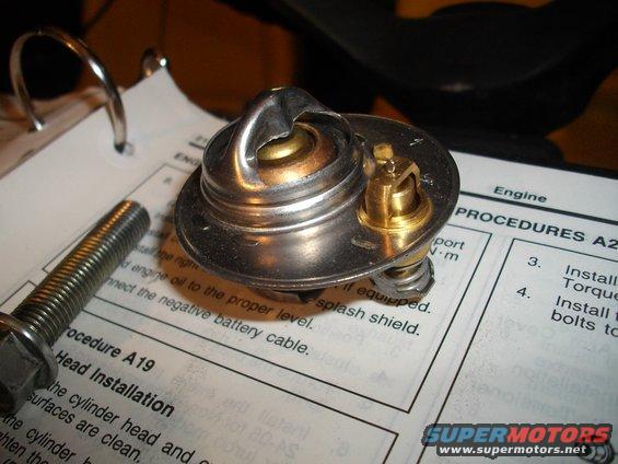 Thermostat part on a service manual page with text about head installation