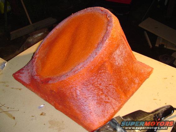 Orange custom fiberglass part with textured finish