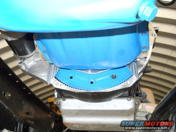 close-up of vehicle transmission bell housing with blue cover