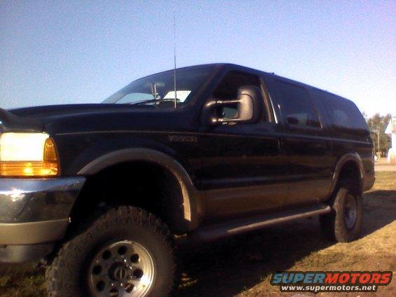 Black 2000 Ford Excursion SUV, three-quarter front view, parked outdoors